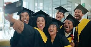 Students on campus with graduation caps
